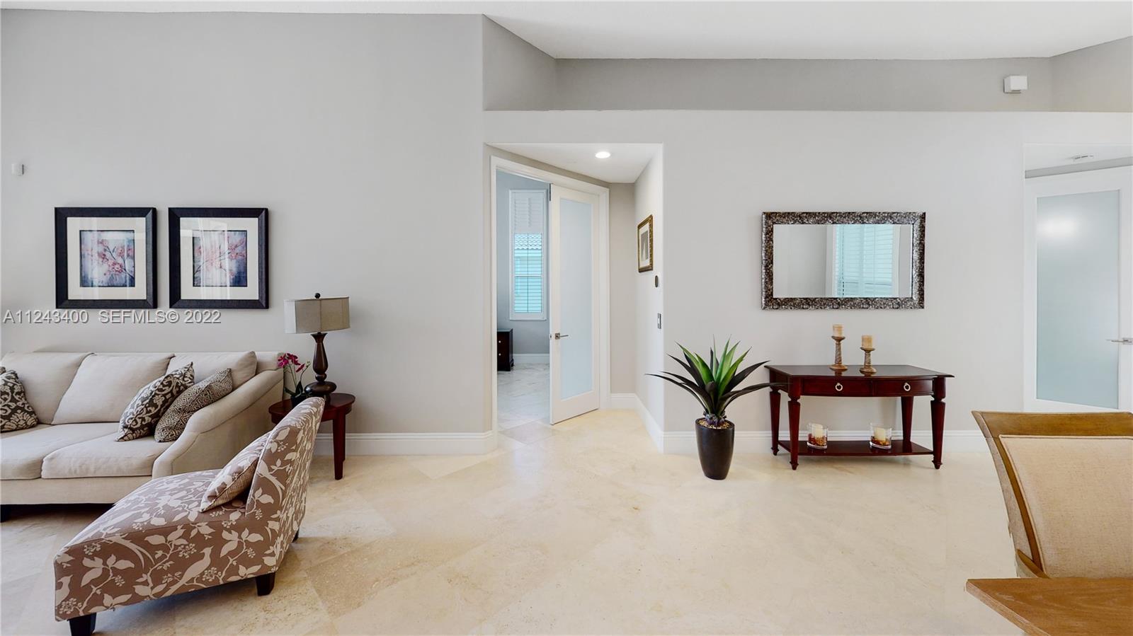 1136 Ginger Circle Weston, FL 33326 - Photo 29 of 32 a living room with furniture and white walls