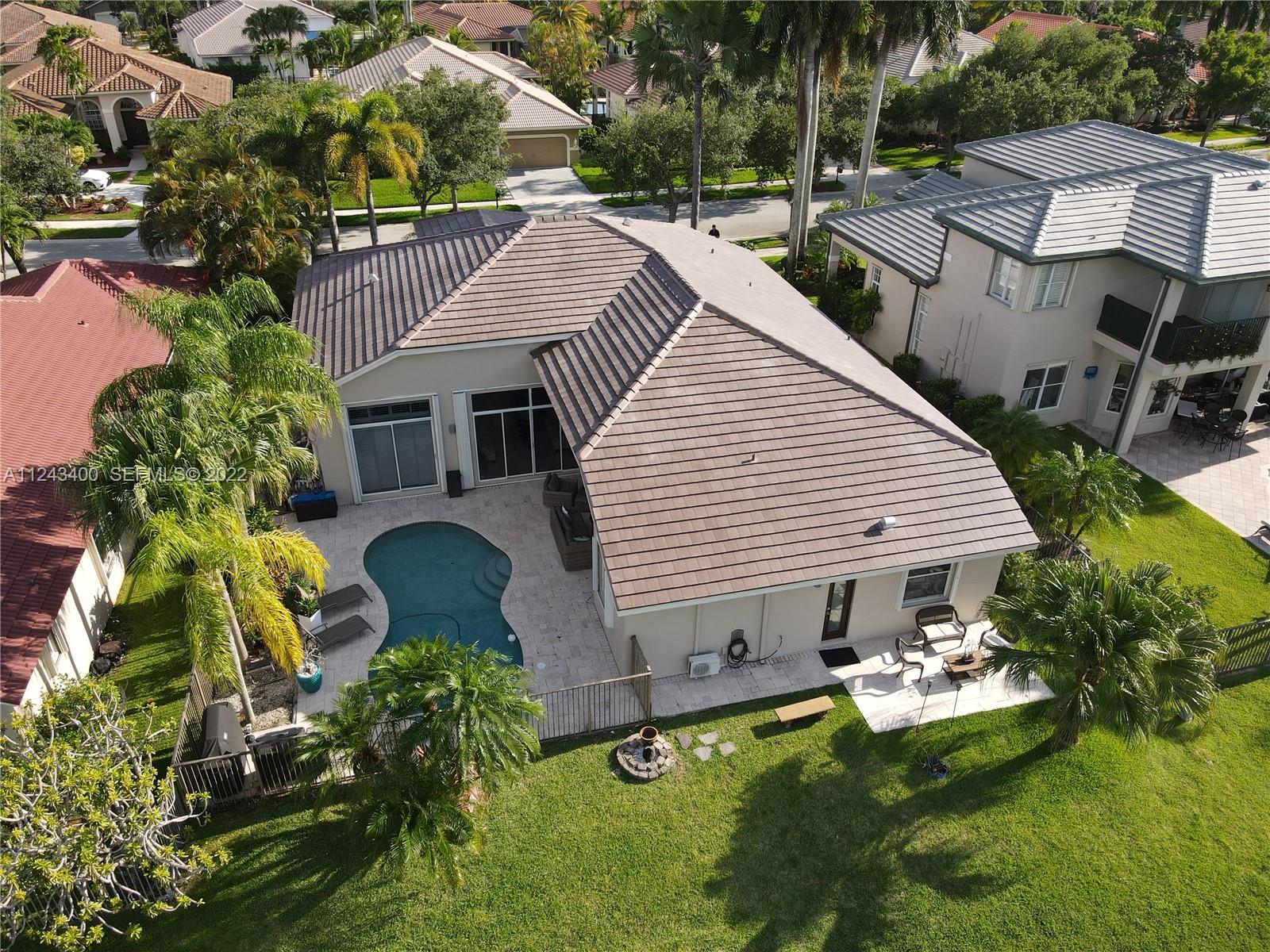 1136 Ginger Circle Weston, FL 33326 - Photo 31 of 32 a view of a house with backyard and sitting area