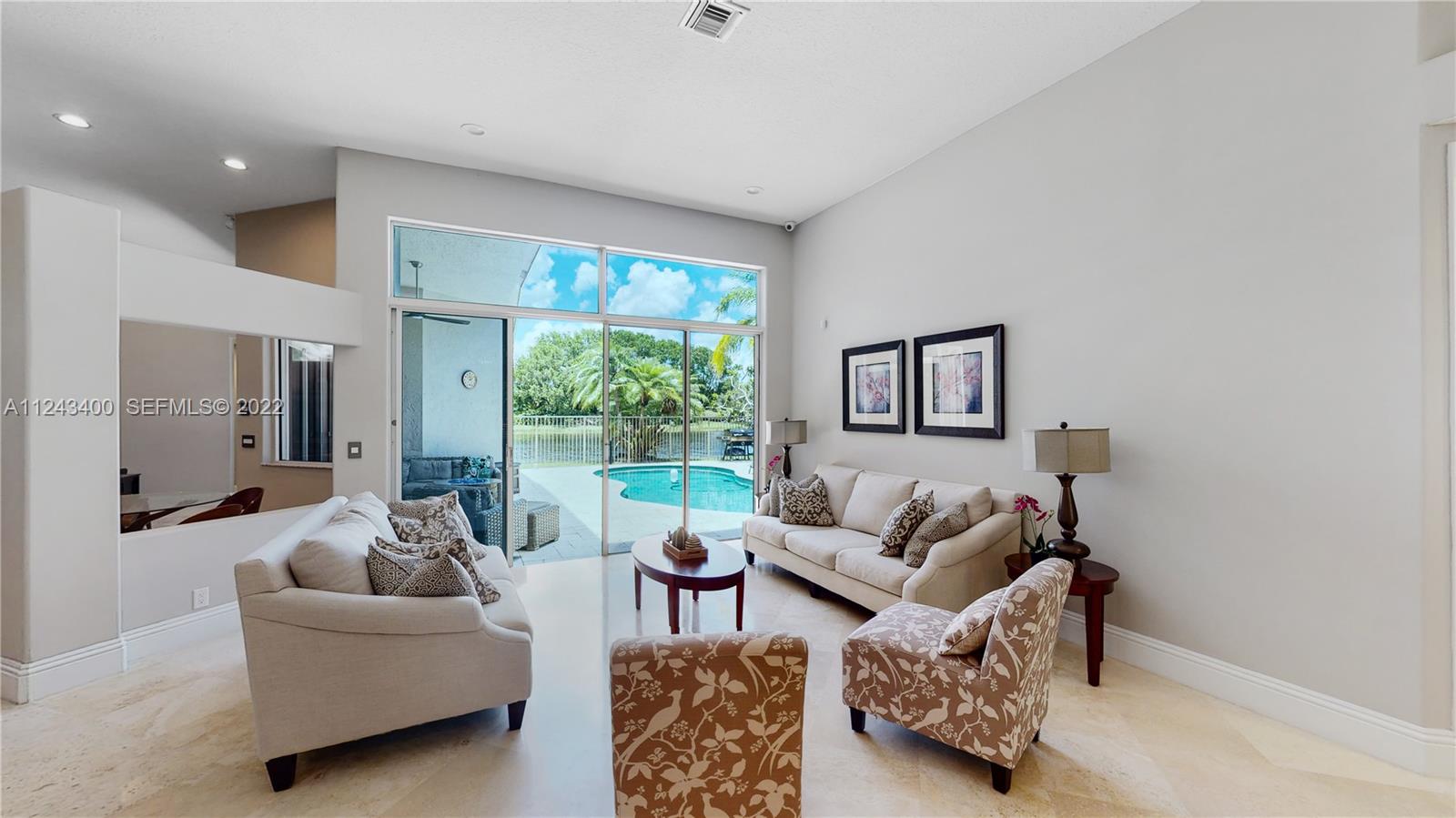1136 Ginger Circle Weston, FL 33326 - Photo 6 of 32 a living room with furniture and a large window