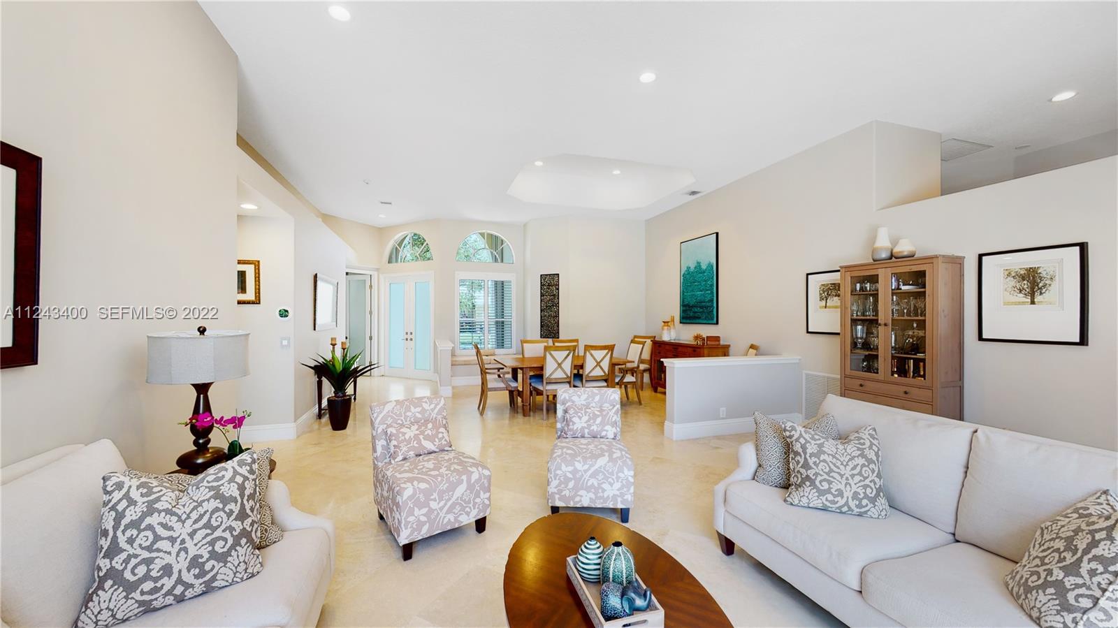 1136 Ginger Circle Weston, FL 33326 - Photo 7 of 32 a living room with furniture and wooden floor