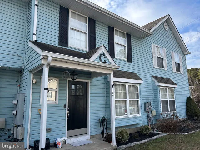 a front view of a house with a large windows