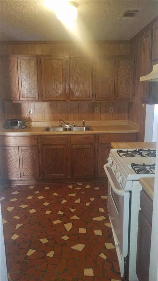 365 King Road Memphis, TN 38109 - Photo 6 of 9 a kitchen with a sink and cabinets