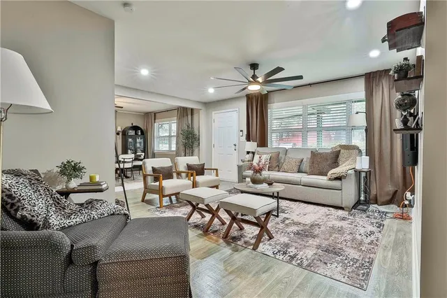 a living room with furniture and a large window
