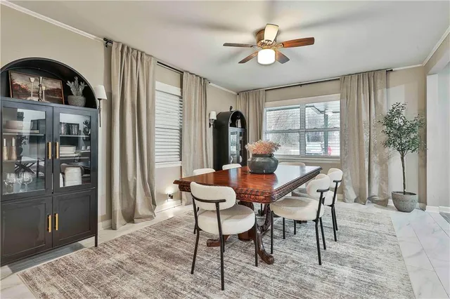 a view of a dining room with furniture window and outside view