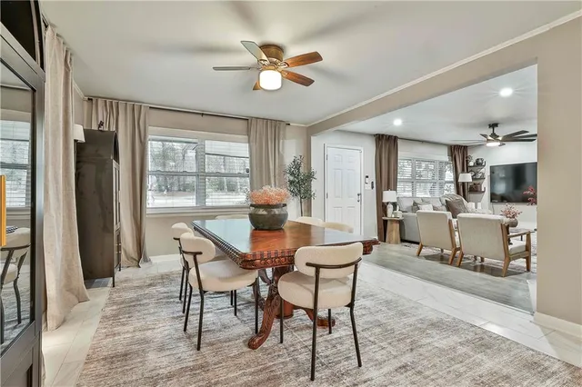 a view of a dining room with furniture window and outside view