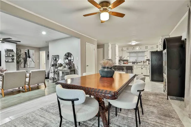 a dining room with furniture and window