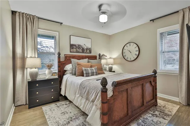 a bed room with a bed and a window