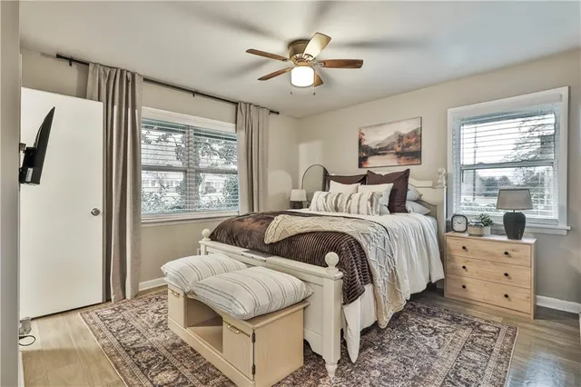 a bedroom with a large bed and a window