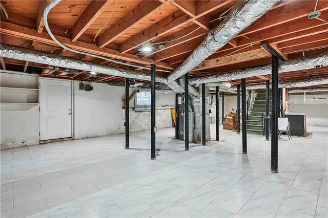 a view of an empty room with wooden walls