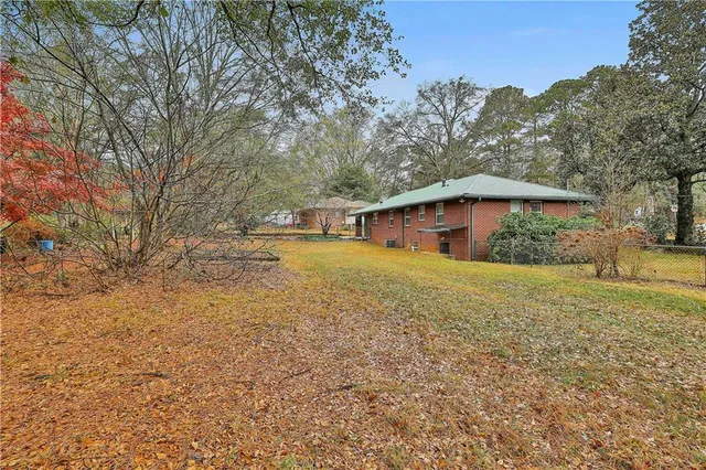 a utility room with glass door and shower
