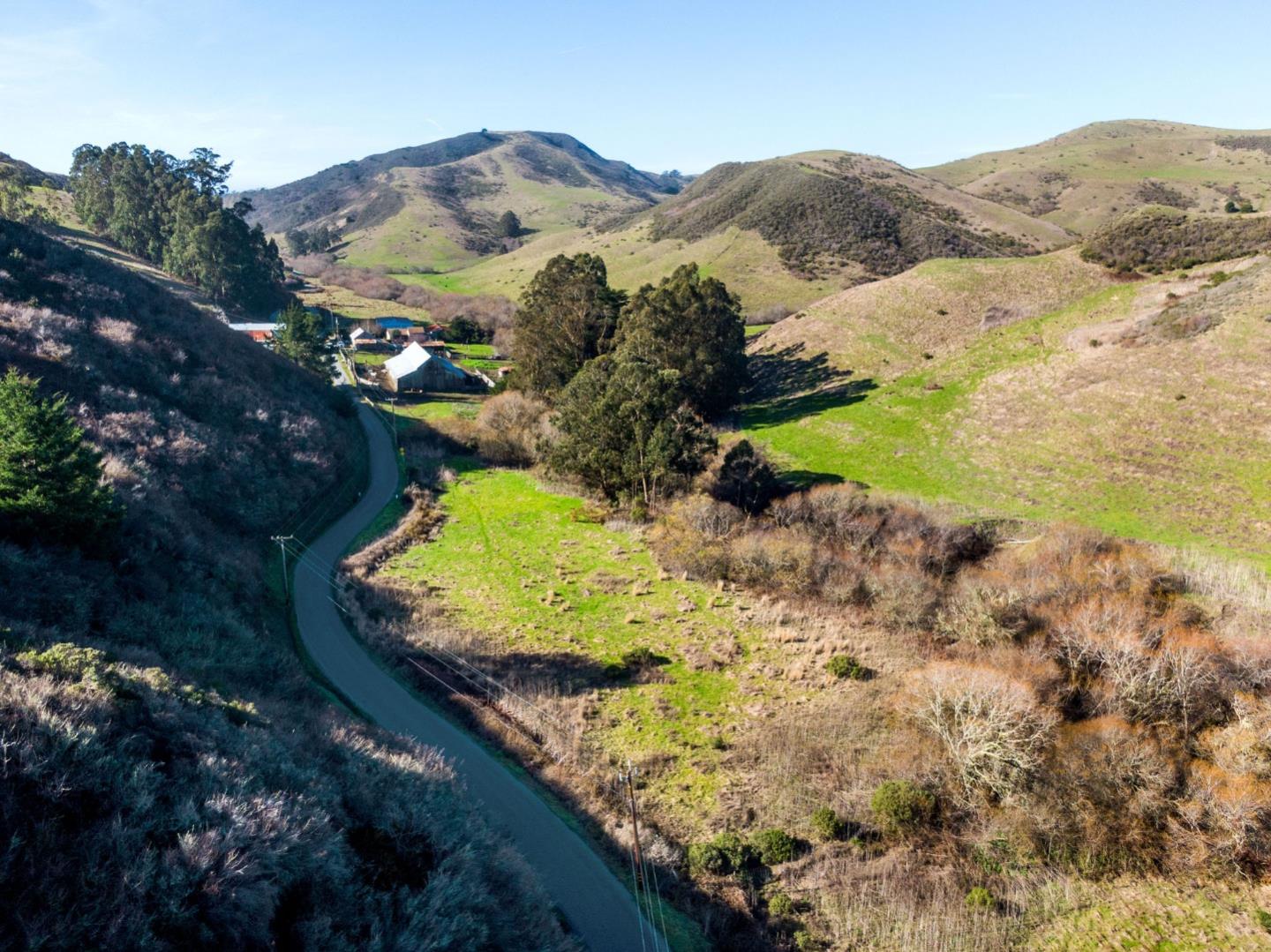 3225 Pomponio Creek Road San Gregorio, CA 94074 - Photo 2 of 24 a view of a lake with mountains