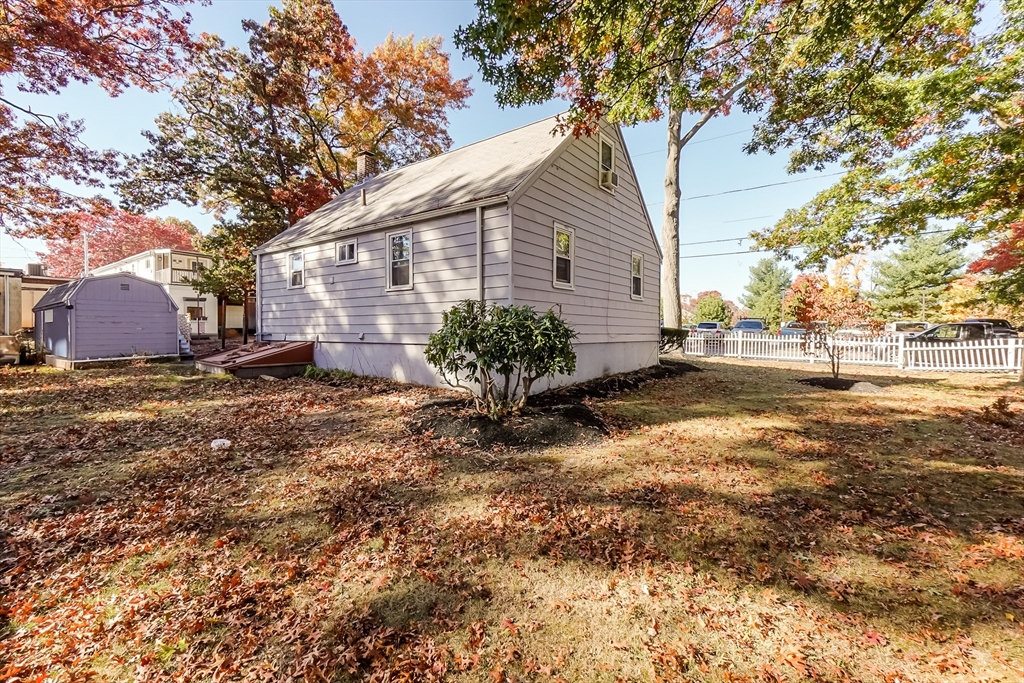 5 Oliver Street Randolph, MA 02368 - Photo 5 of 29 a view of a yard with plants and trees