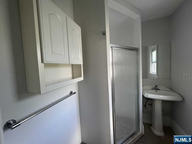 44 Gates Avenue, Unit 2 Montclair, NJ 07042 - Photo 15 of 15 a bathroom with a sink and a mirror
