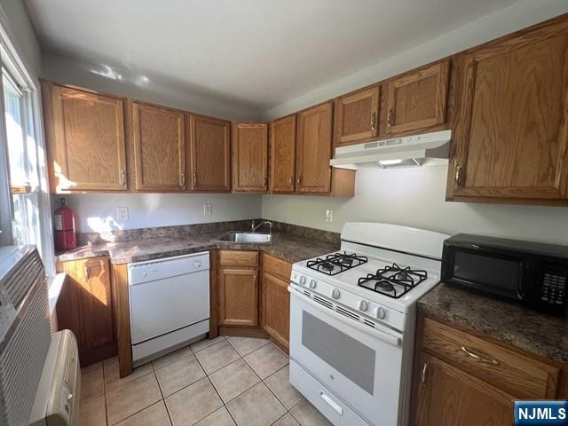44 Gates Avenue, Unit 2 Montclair, NJ 07042 - Photo 4 of 15 a kitchen with granite countertop cabinets and steel appliances