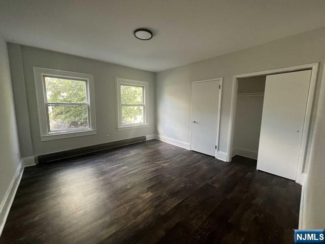 44 Gates Avenue, Unit 2 Montclair, NJ 07042 - Photo 8 of 15 an empty room with wooden floor and windows