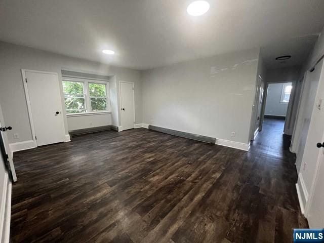 44 Gates Avenue, Unit 2 Montclair, NJ 07042 - Photo 9 of 15 an empty room with wooden floor and windows
