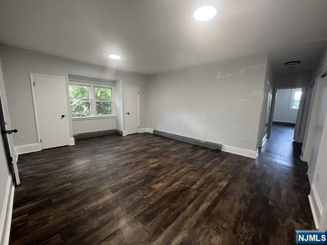 44 Gates Avenue, Unit 2 Montclair, NJ 07042 - Photo 10 of 15 an empty room with wooden floor and windows
