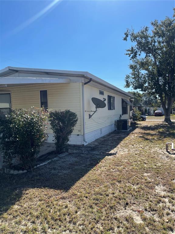 109 Ridge Manor Drive Lake Wales, FL 33853 - Photo 11 of 16 a view of a house with a yard