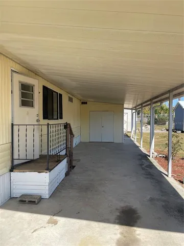 a view of a porch with furniture