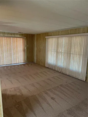 en empty room with windows