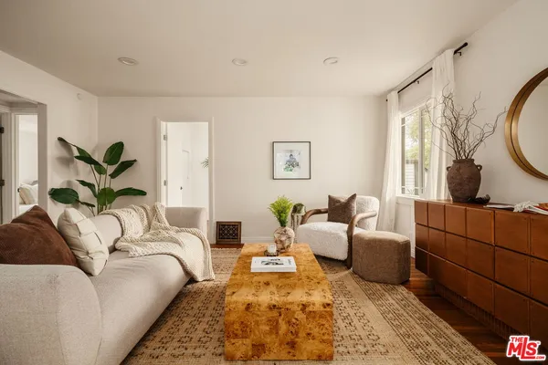 a living room with furniture or couch and a window