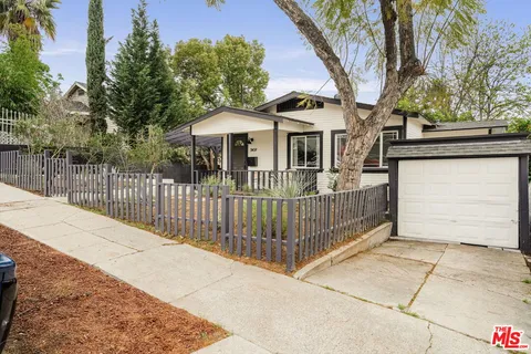 a front view of a house with a garage