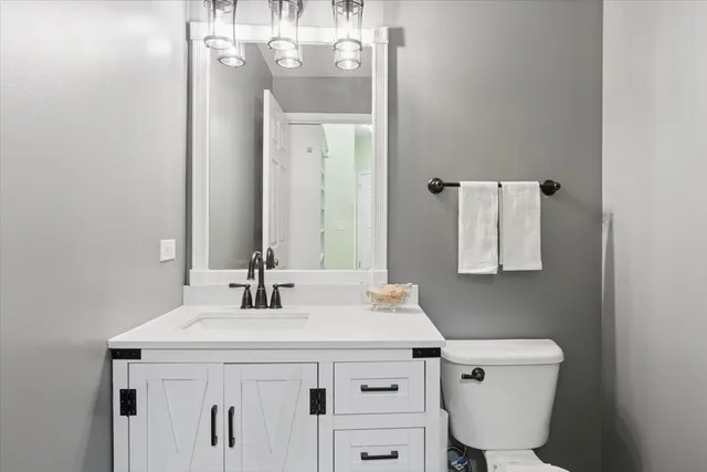 a kitchen with stainless steel appliances granite countertop a stove and a microwave