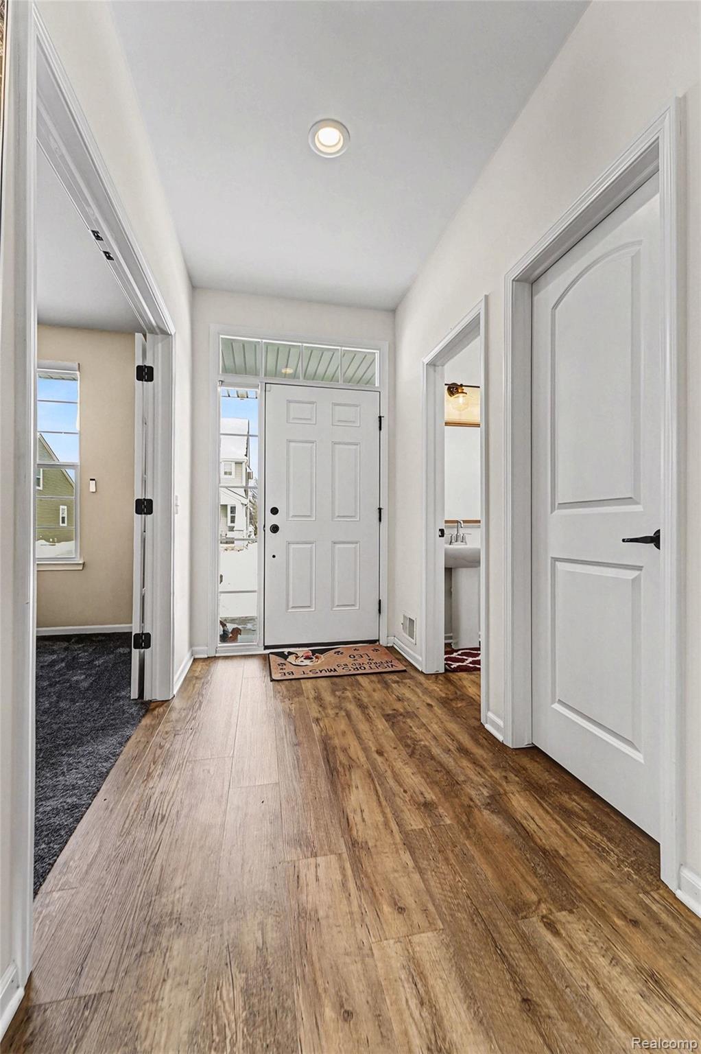 2471 Massoit Road Royal Oak, MI 48073 - Photo 6 of 49 Entryway featuring dark wood-type flooring and baseboards