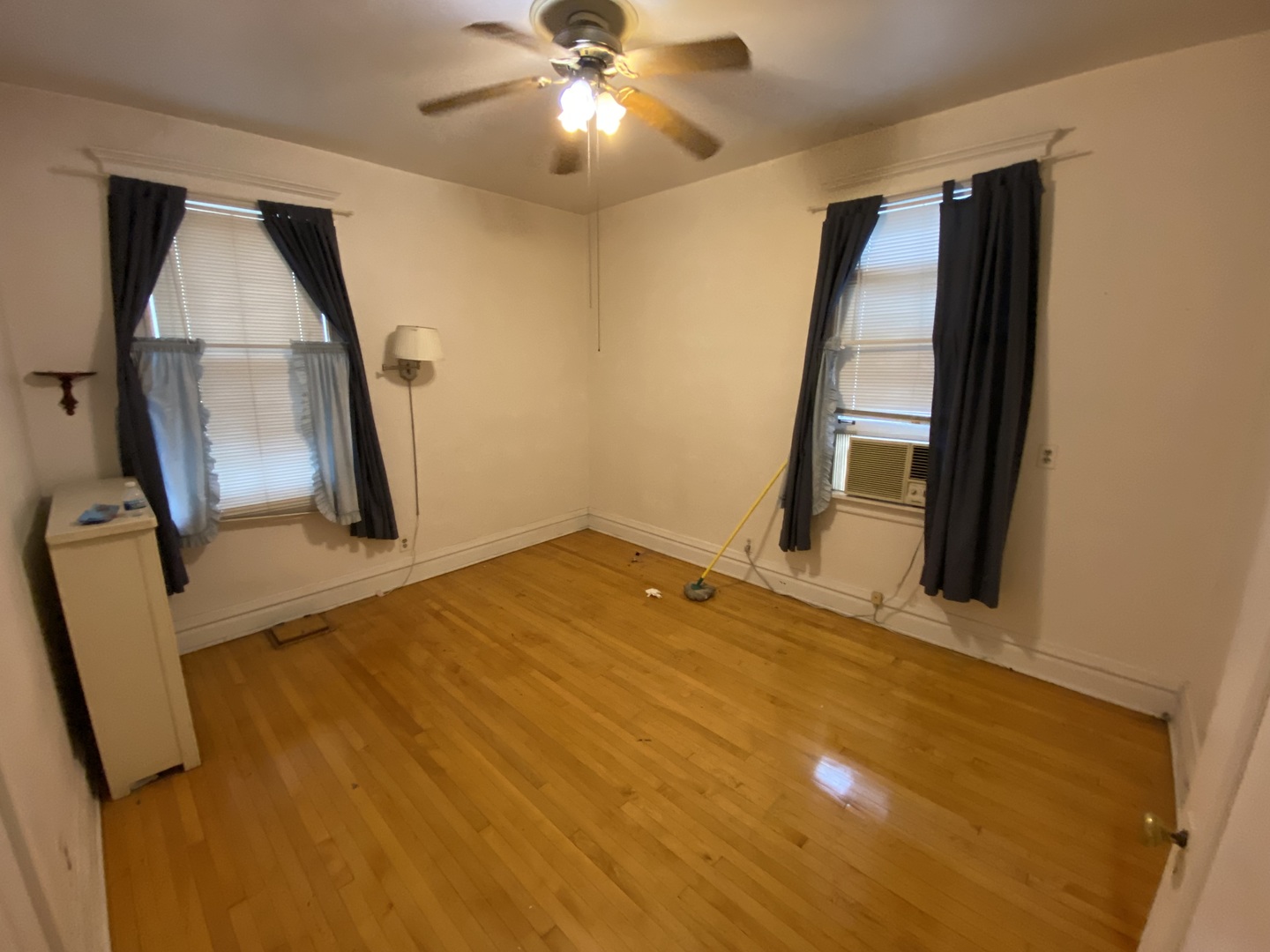 3902 North Hamilton Avenue Chicago, IL 60618 - Photo 15 of 24 a view of a livingroom with wooden floor and a staircase