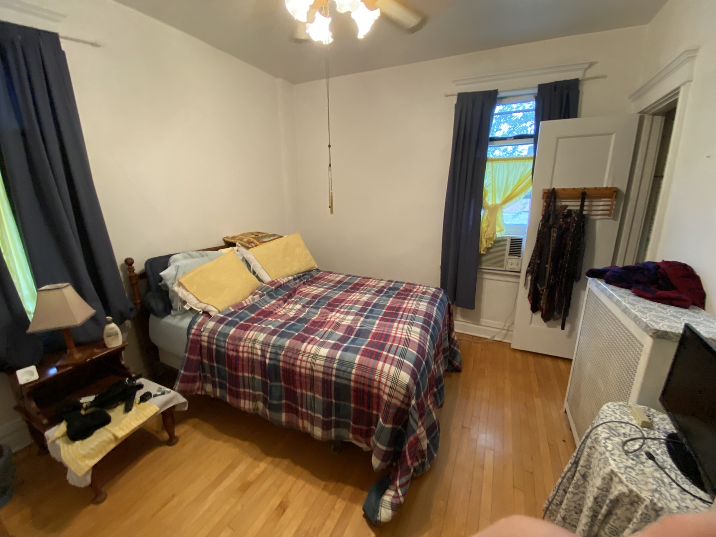 3902 North Hamilton Avenue Chicago, IL 60618 - Photo 18 of 24 a bedroom with bed and a flat tv screen on a dresser