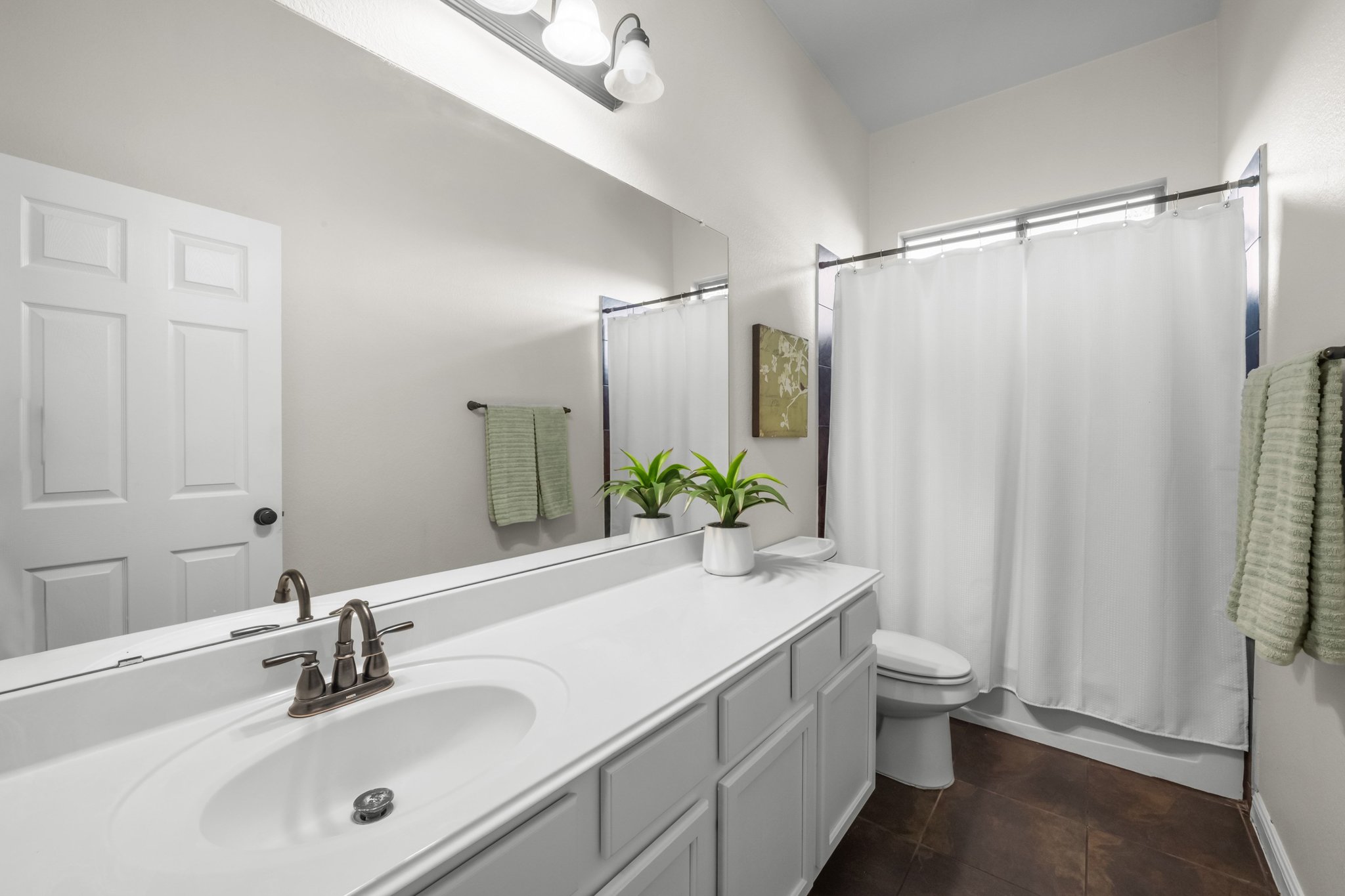 22112 Rock Wren Road Spicewood, TX 78669 - Photo 22 of 40 Bathroom featuring vanity and shower / bathtub combination with curtain
