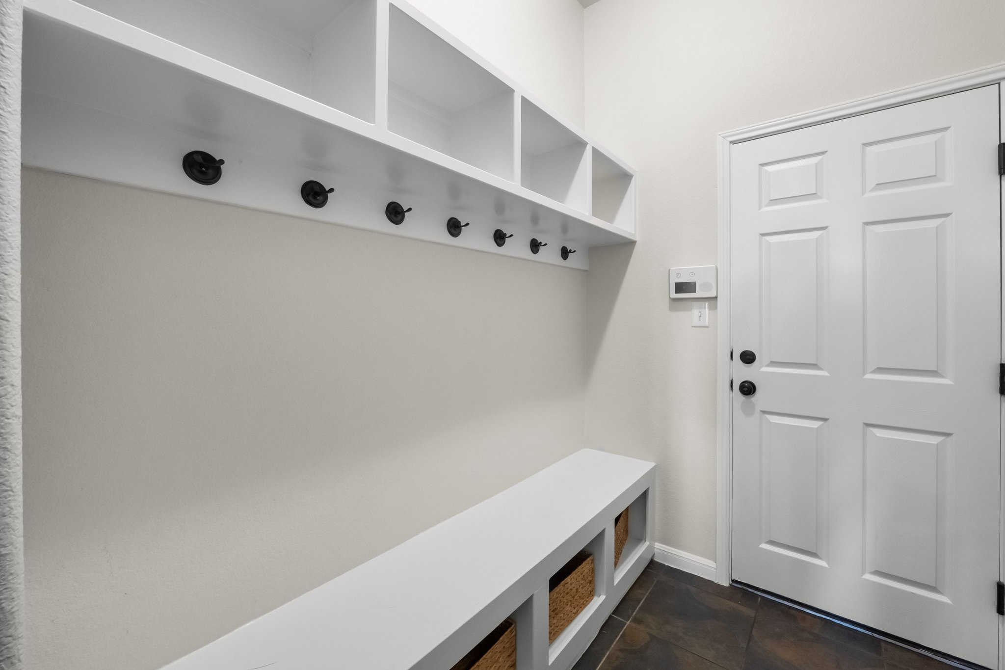 22112 Rock Wren Road Spicewood, TX 78669 - Photo 24 of 40 Mudroom with baseboards