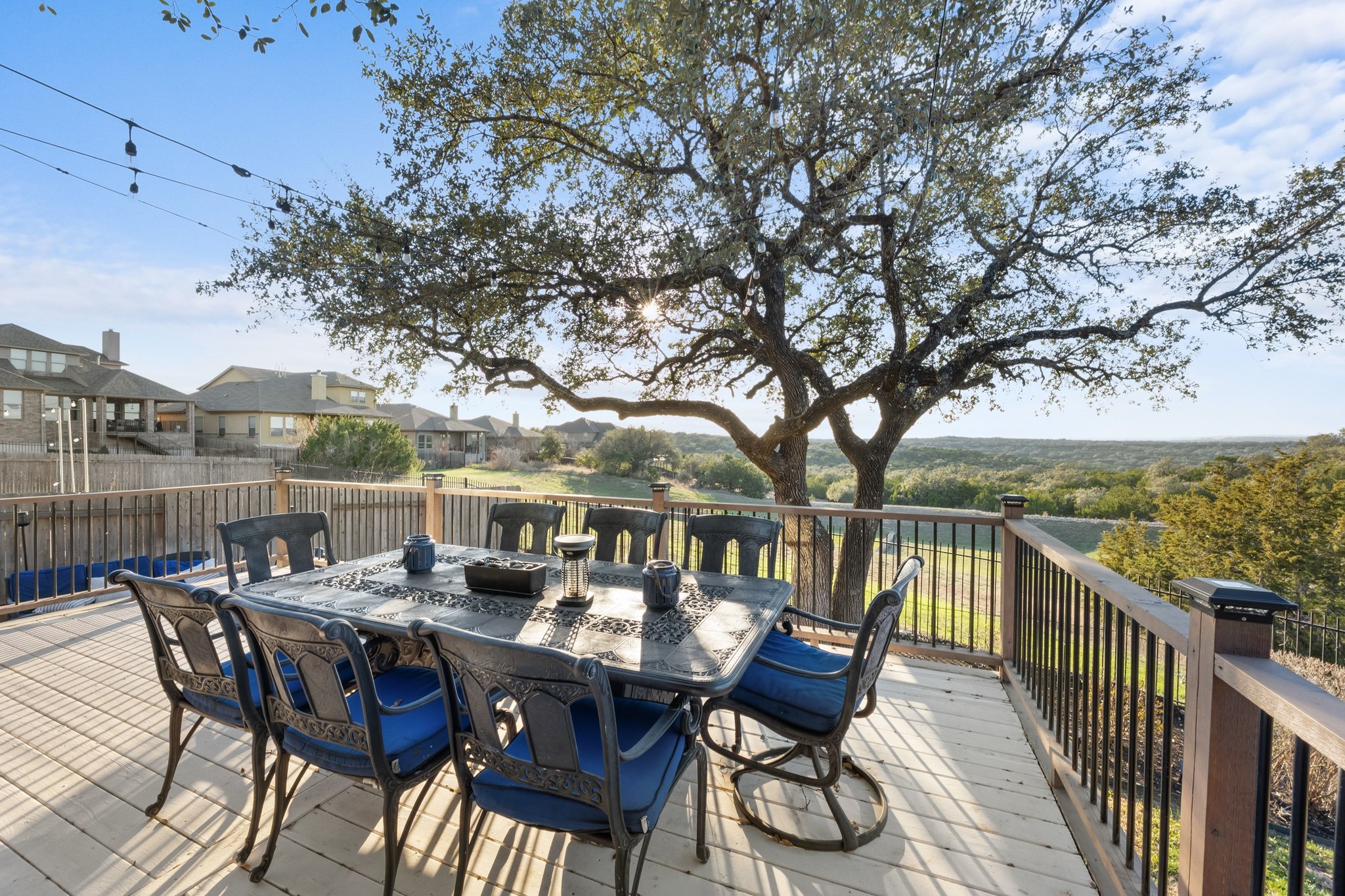 22112 Rock Wren Road Spicewood, TX 78669 - Photo 35 of 40 Wooden terrace with outdoor dining space and a residential view