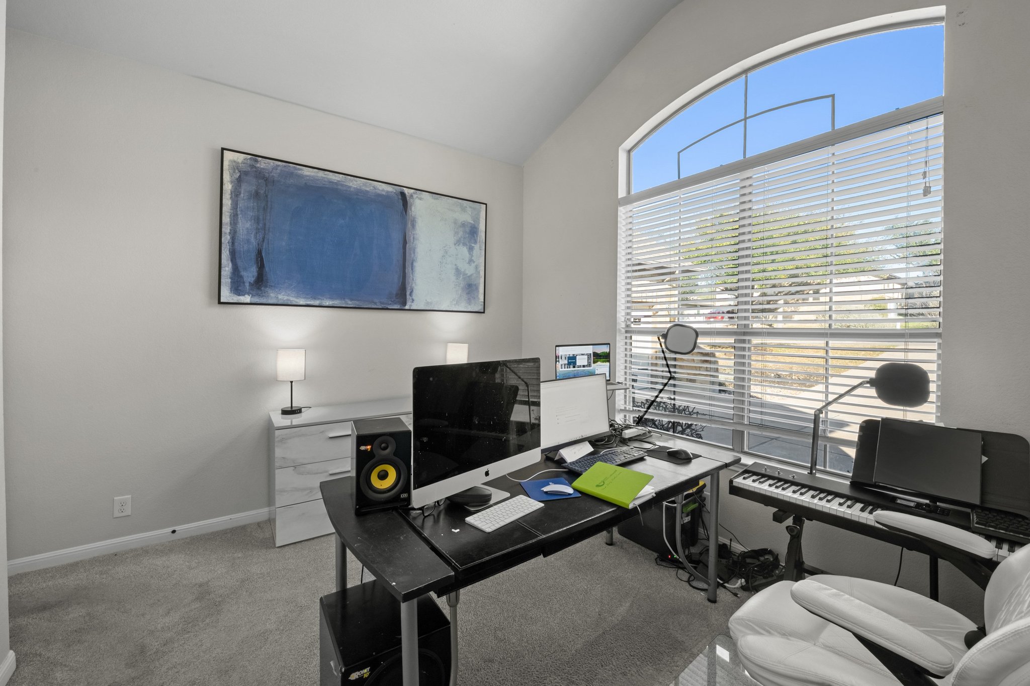 22112 Rock Wren Road Spicewood, TX 78669 - Photo 5 of 40 Home office featuring vaulted ceiling and light colored carpet