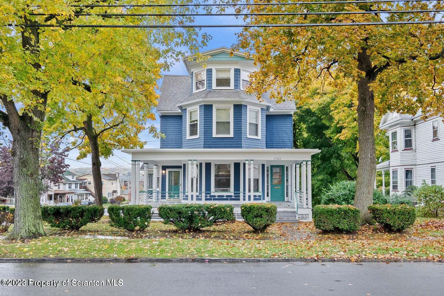 1703 Sanderson Street Scranton, PA 18512 - Photo 1 of 24 front view of a brick house with a yard