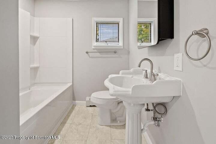 1703 Sanderson Street Scranton, PA 18512 - Photo 11 of 24 a bathroom with a sink toilet and shower