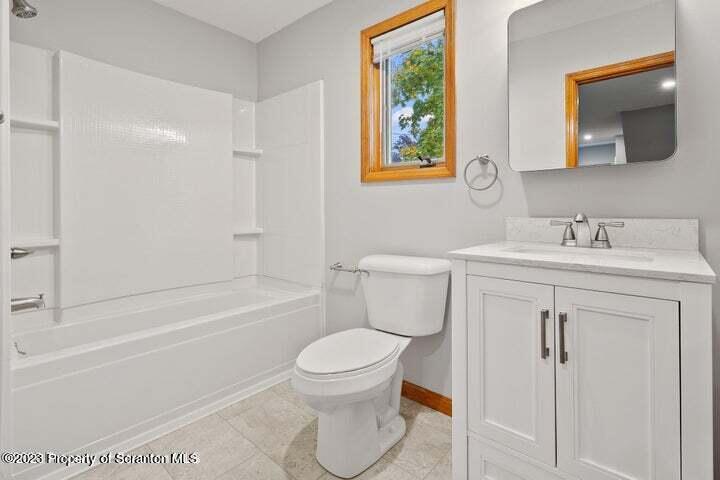 1703 Sanderson Street Scranton, PA 18512 - Photo 20 of 24 a bathroom with a sink toilet vanity and shower