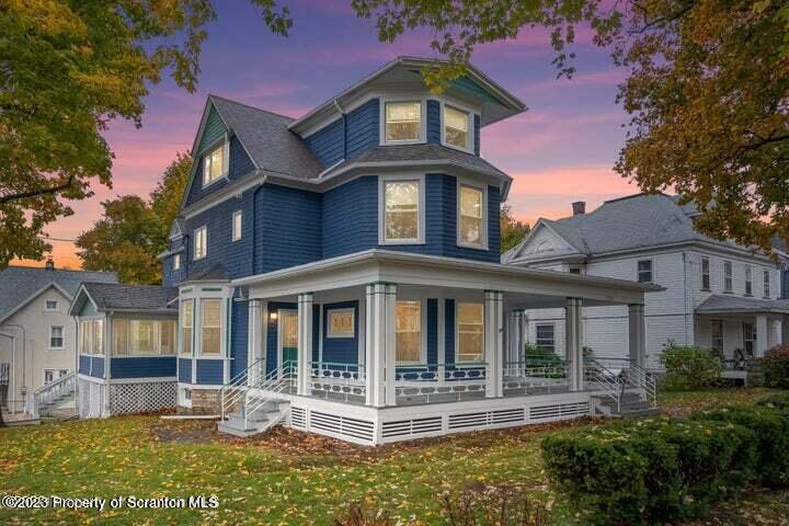 1703 Sanderson Street Scranton, PA 18512 - Photo 2 of 24 a front view of a house with a yard