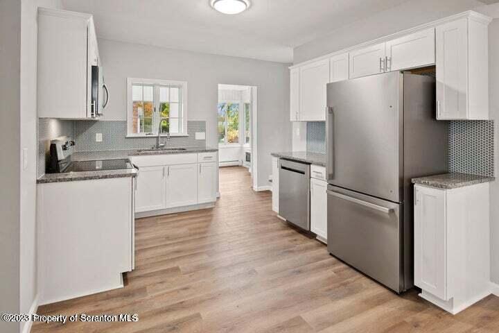 1703 Sanderson Street Scranton, PA 18512 - Photo 9 of 24 a kitchen with a refrigerator stove and sink