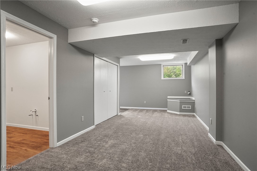 6885 Red Brush Road Ravenna, OH 44266 - Photo 32 of 35 Recently partially finished basement, perfect for an office, in-law suite or rec room.