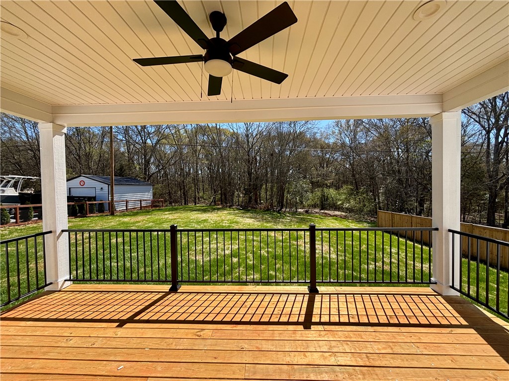 26 B Fisher Jenkins Road Anderson, SC 29625 - Photo 17 of 24 This spacious deck offers tranquil views of the expansive yard, perfect for outdoor enjoyment.