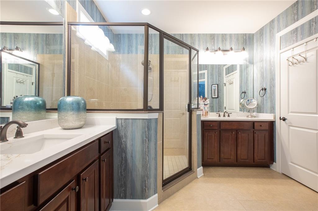 3538 Black Cherry Point Gainesville, GA 30504 - Photo 15 of 44 a bathroom with a double vanity sink and a mirror