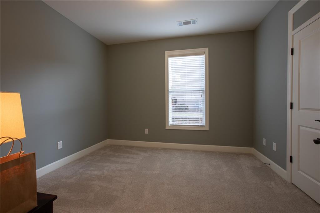3538 Black Cherry Point Gainesville, GA 30504 - Photo 17 of 44 an empty room with a window