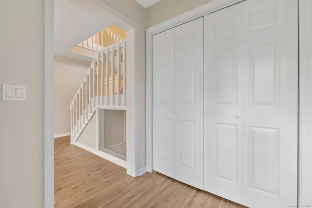 a view of front door with wooden floor