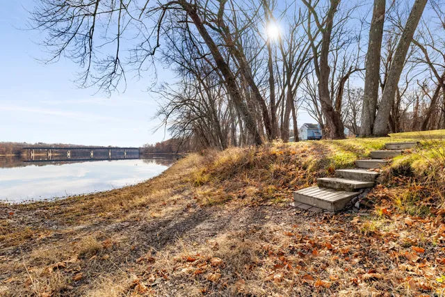 a view of a lake with a yard