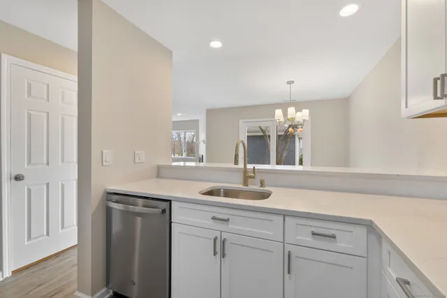 a kitchen with a sink and cabinets