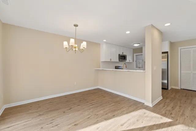 a view of a kitchen cabinets and wooden floor