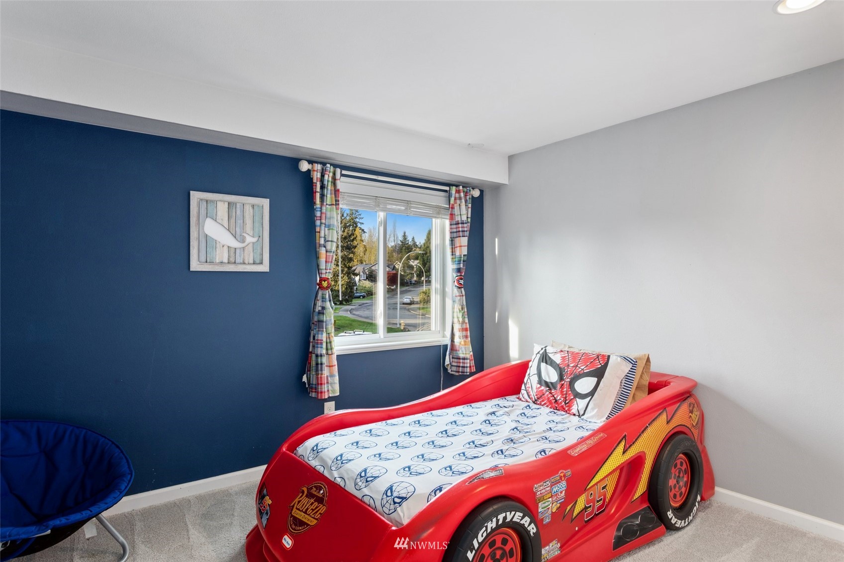 4805 Northeast 21st Street Renton, WA 98059 - Photo 21 of 40 a bedroom with a bed and a window