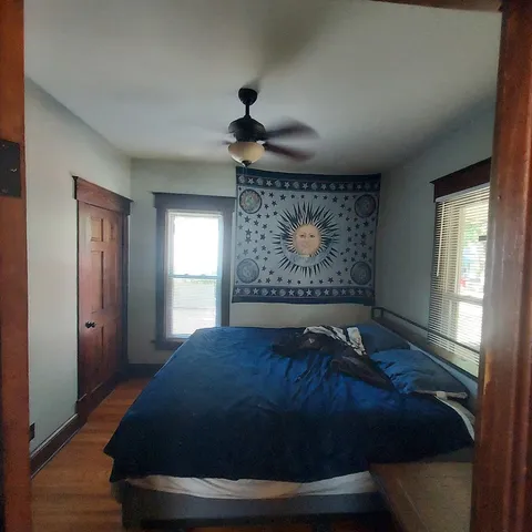 a dining room with furniture and wooden floor
