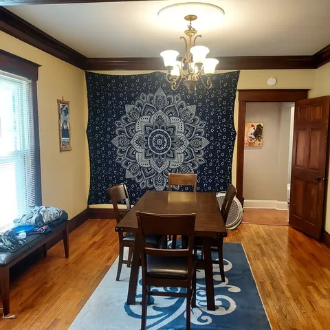 a kitchen with cabinets appliances a sink and a window